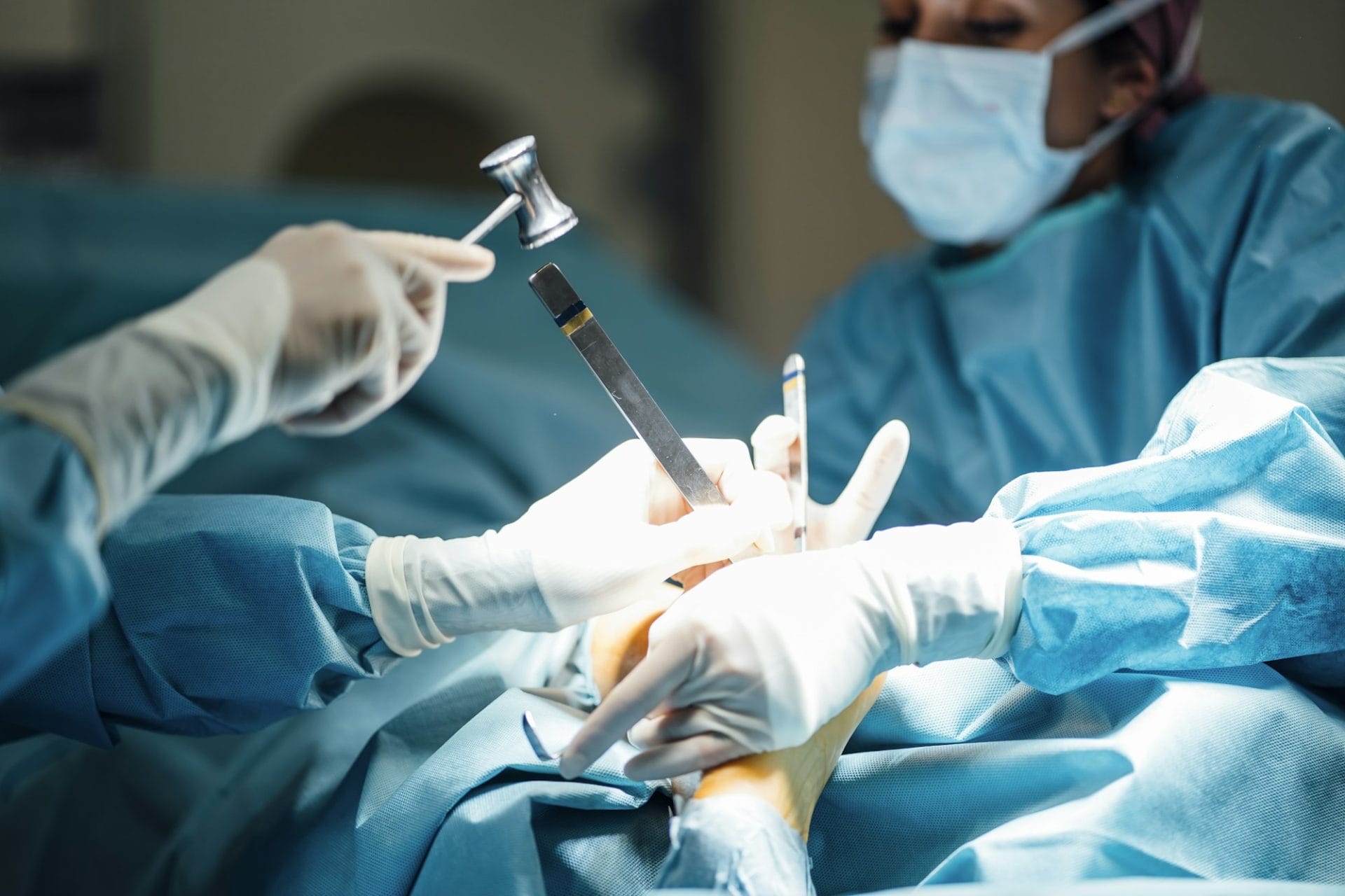 Surgeons and nurse during a foot surgery